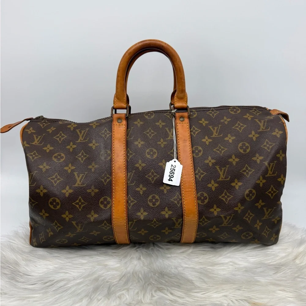 Louis Vuitton Brown Monogram Duffel Bag with Tan‎ Leather Trim